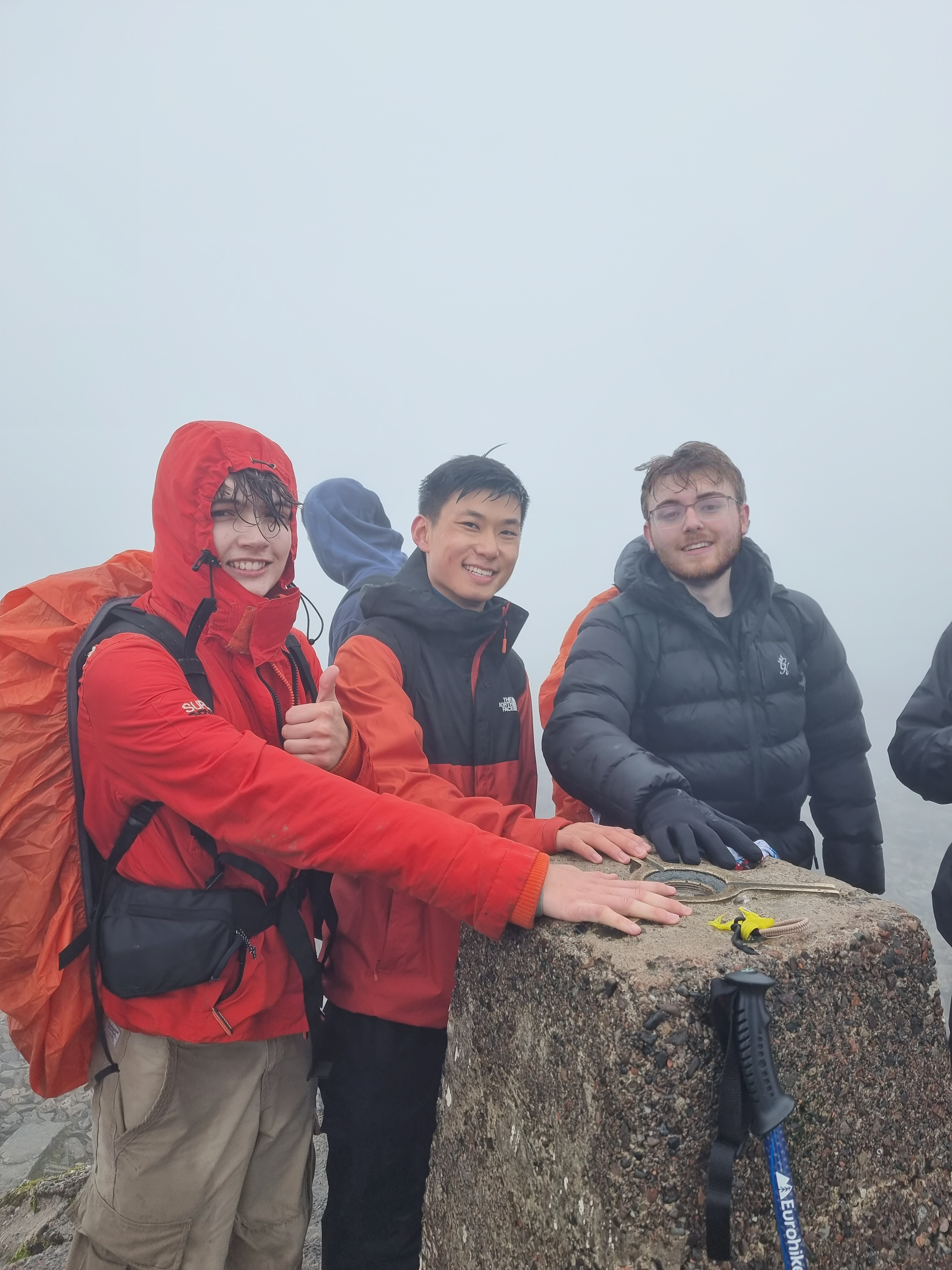 Joshua reaching the summit of Ben Nevis during the final hike